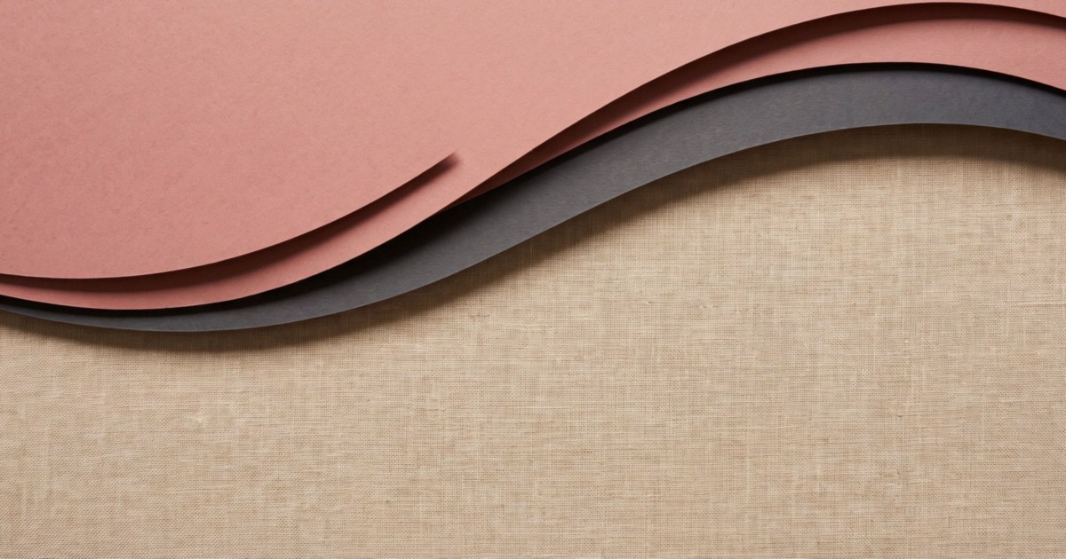 Layered paper-cut curves in rose and charcoal sweeping across a linen background.